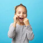 child flossing for gum disease prevention